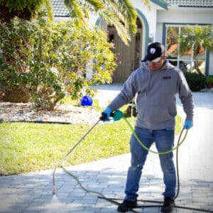 expert pressure washer cleaning sidewalk in residential area of cocoa fl