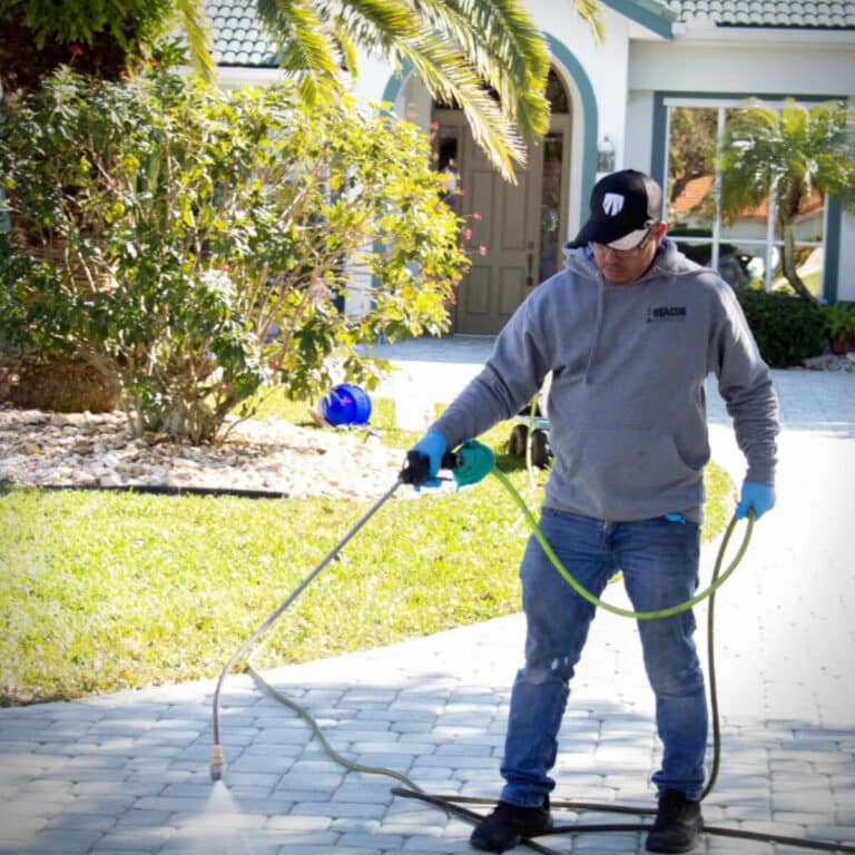 expert pressure washer cleaning sidewalk in residential area of melbourne fl