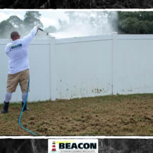 professional house washer cleaning wood fence in cocoa fl